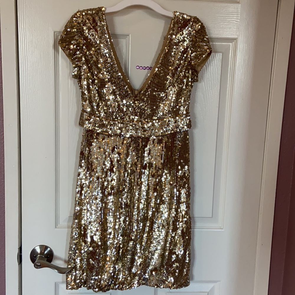 Show stopper Jovani dress in a size 2 silver/gold sequence 100% silk